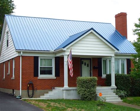 metal roof on a brick house|matching brick and roof colors.